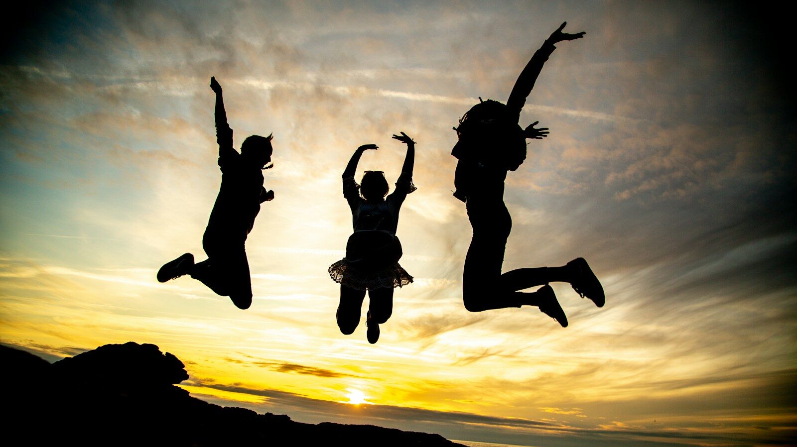 Photo by Alex Guillaume silhouette of jumping people